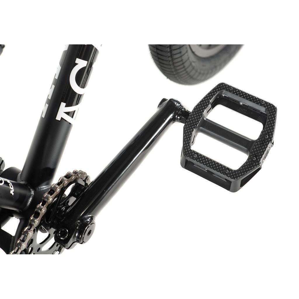 Close-up of the Academy Trooper 20 Inch Bike’s black crank arm, pedal, chainring, and rear wheel—perfect details for riders discovering their first beginner BMX.