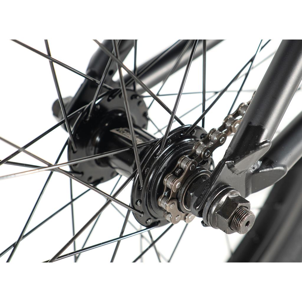 Close-up of the Academy Trooper 20 Inch Bike’s rear wheel hub, featuring spokes, axle, and chain on the cog—perfect for youth BMX riders and beginners.
