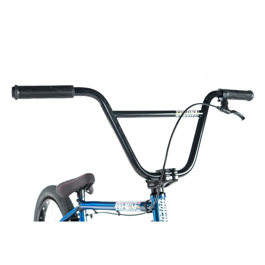 Close-up of the handlebars and front section of the Colony Premise 20 Inch Bike, featuring black grips, a brake lever, and part of the blue chromoly frame against a white background.