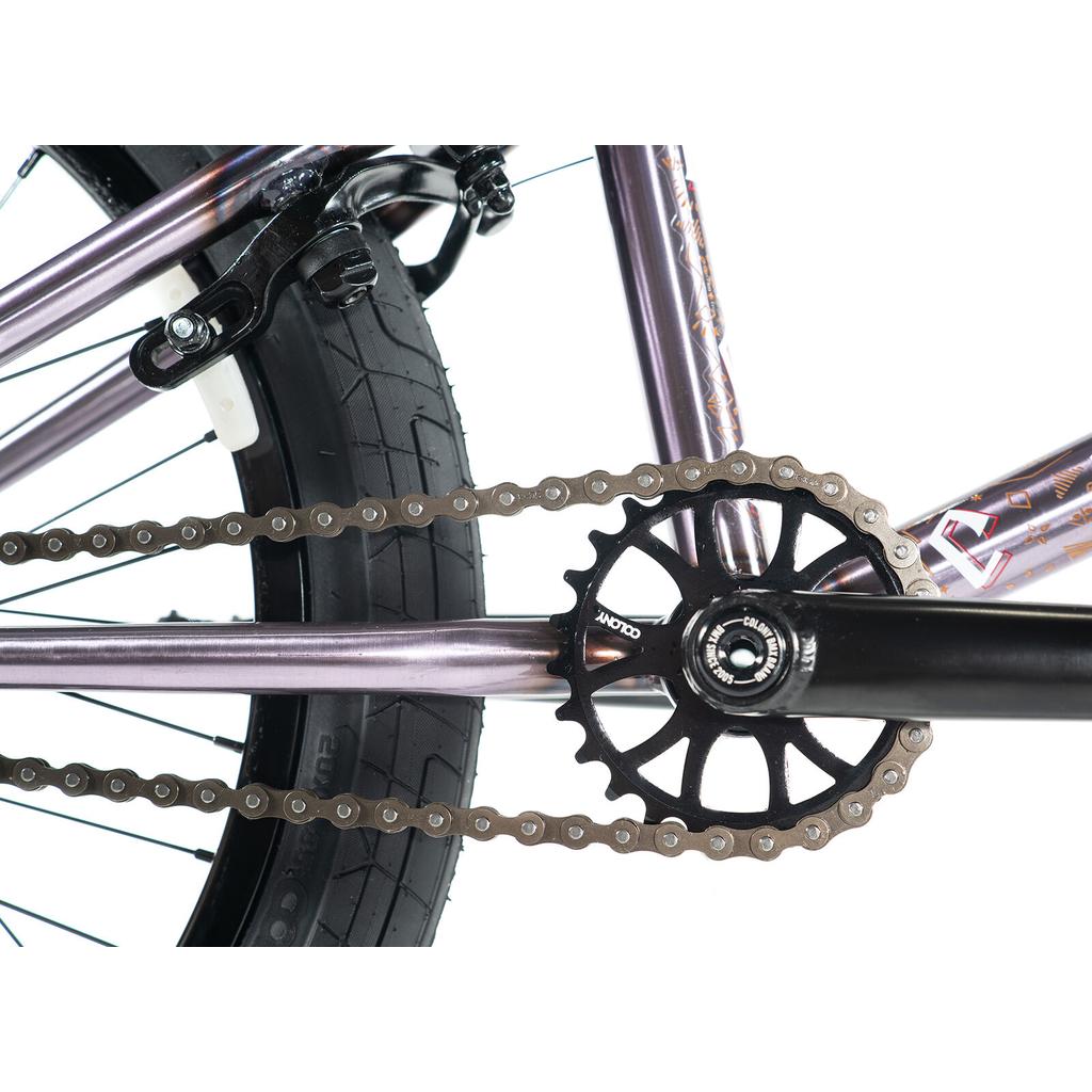 Close-up of the Colony Rico Elite 20 Inch Bike drivetrain, highlighting the chain, sprocket, crank arm, and thick rear tire—engineered for pro-level BMX performance.