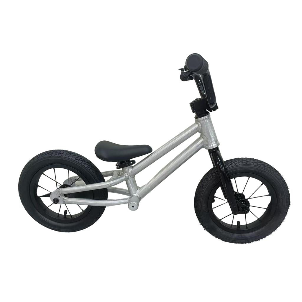 The Colony BMX Horizon Alloy Balance Bike is a small, silver and black pedal-free bike designed for young children to experience their first kids BMX ride.