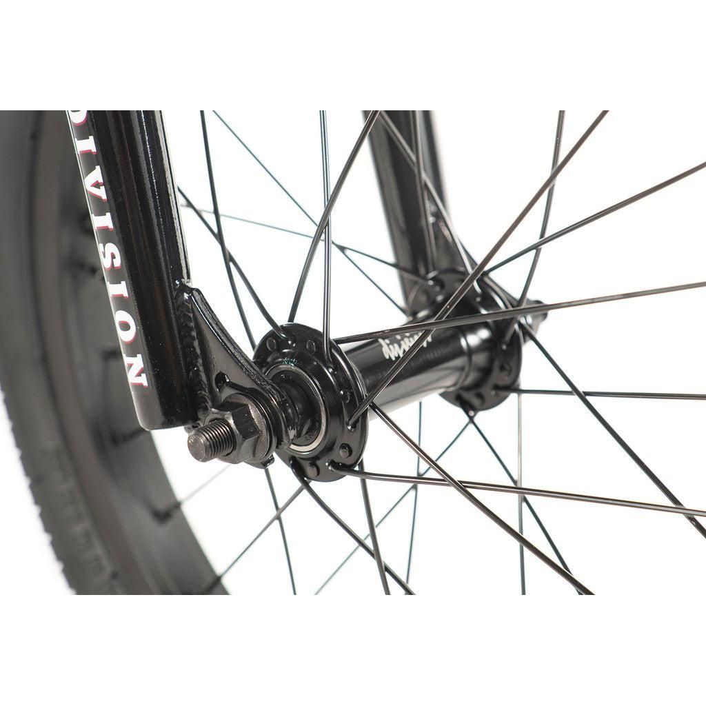 Close-up of a wheel from the Division Blitzer 16 Inch Bike, featuring the spokes, hub, and tire against a white backdrop, emphasizing its entry-level BMX attributes with compact geometry.