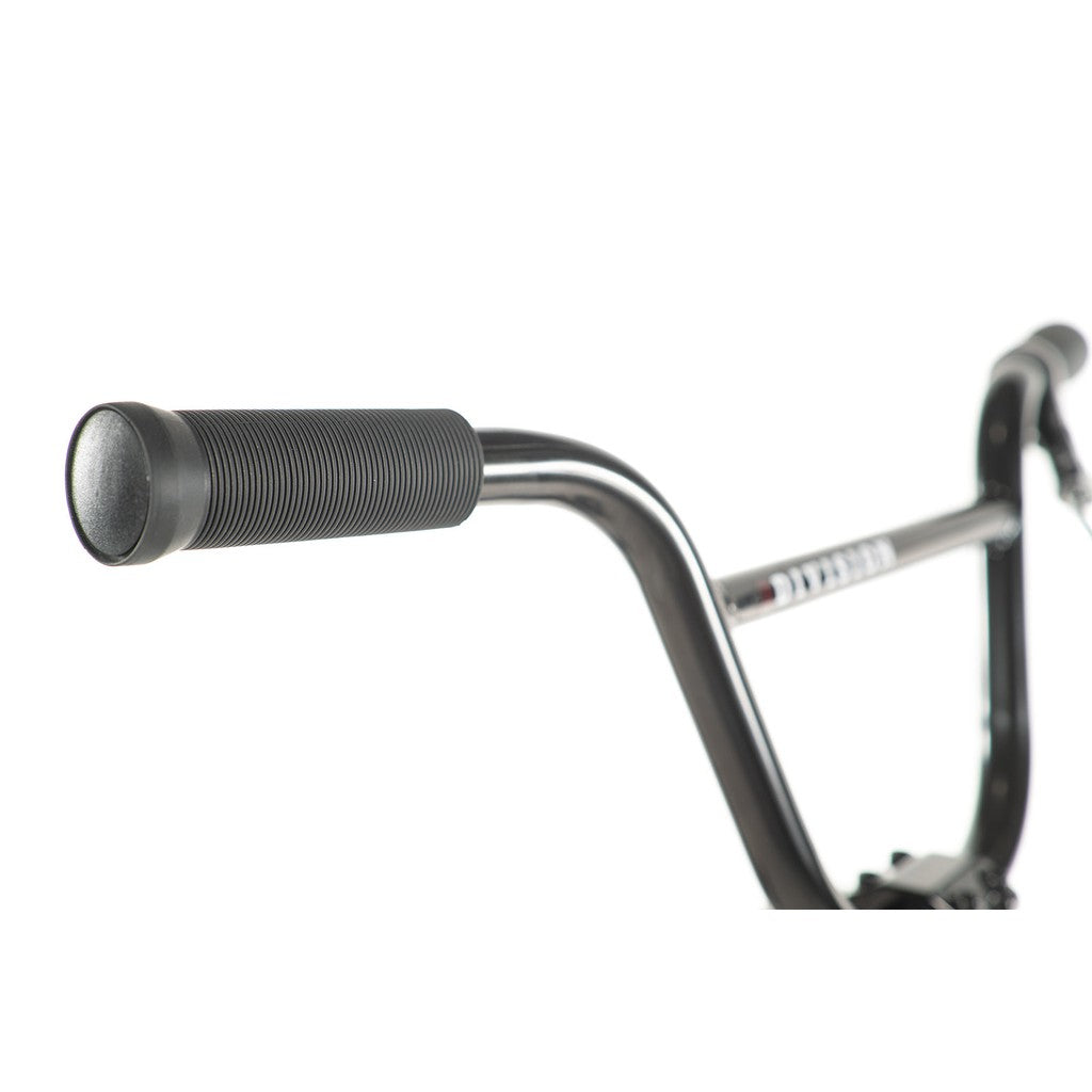 Close-up of a black handlebar from the Division Blitzer 16 Inch Bike, showcasing a textured rubber grip, set against a plain white background.