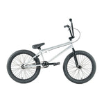 The Division Reark 20 Inch Bike is silver with black handlebars, seat, and tires. Shown in side view on a white background, it features durable 3-piece cranks and a sealed bottom bracket for smooth performance.