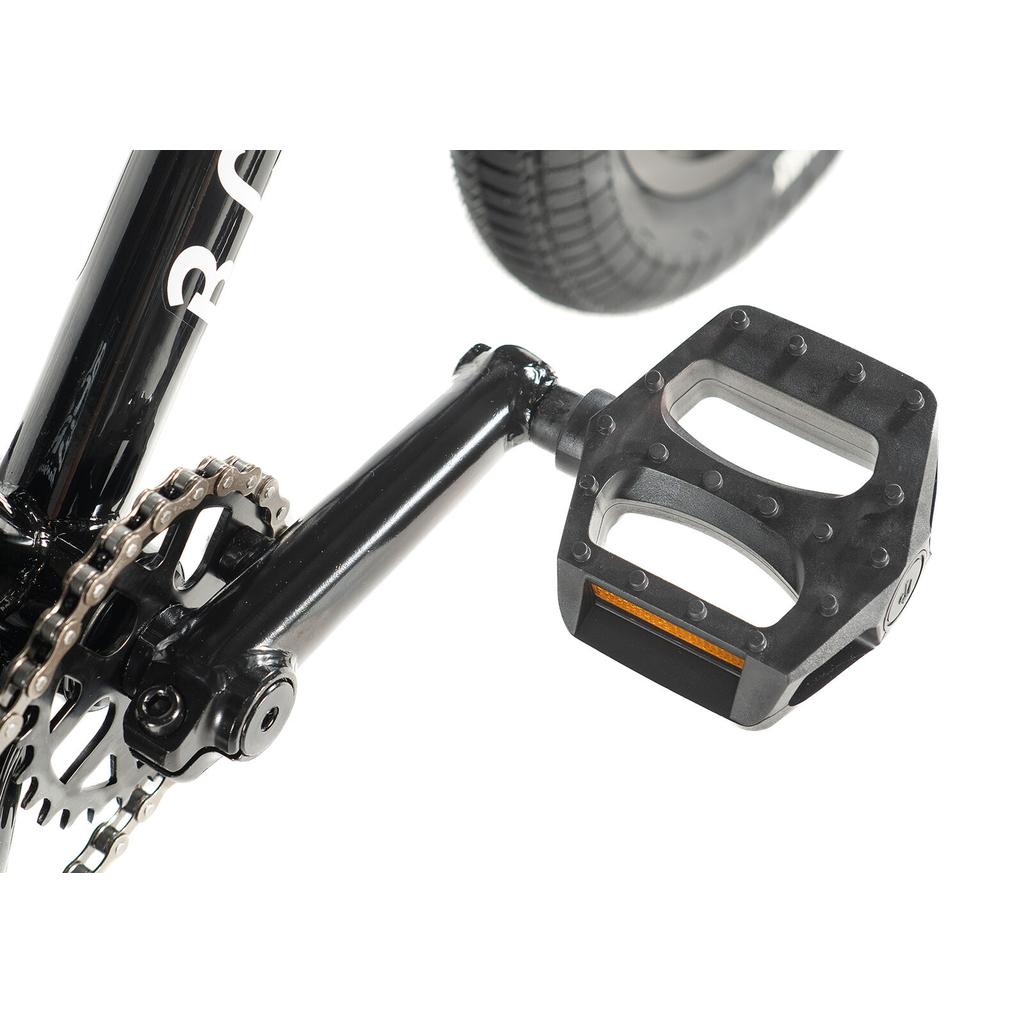 Close-up of the Division Blitzer 14 Inch Bike showing the black BMX pedal, crank arm, chain, and part of the rear wheel against a white background.