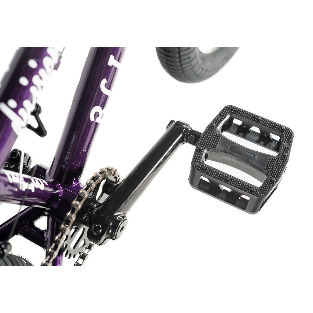 Close-up of a black pedal and crank arm on the Division Blitzer 16 Inch Bike’s purple BMX frame, with chain and rear wheel partially visible against a white background. Ideal for youth riders, this model comes with 16-inch wheels.
