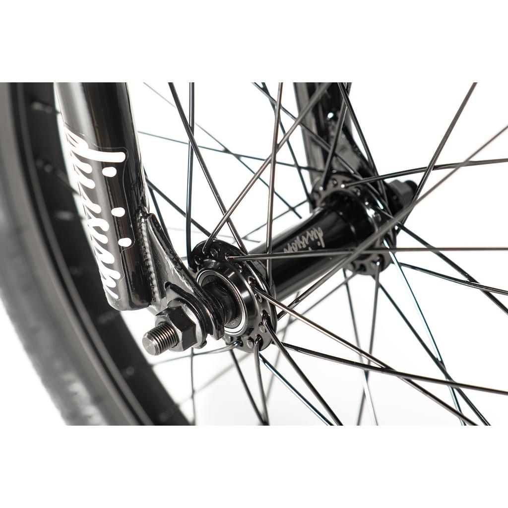 Close-up of the Division Blitzer 18 Inch Bike’s black BMX wheel, showing spokes, axle, and front fork against a white background—perfect for beginner riders or kids.
