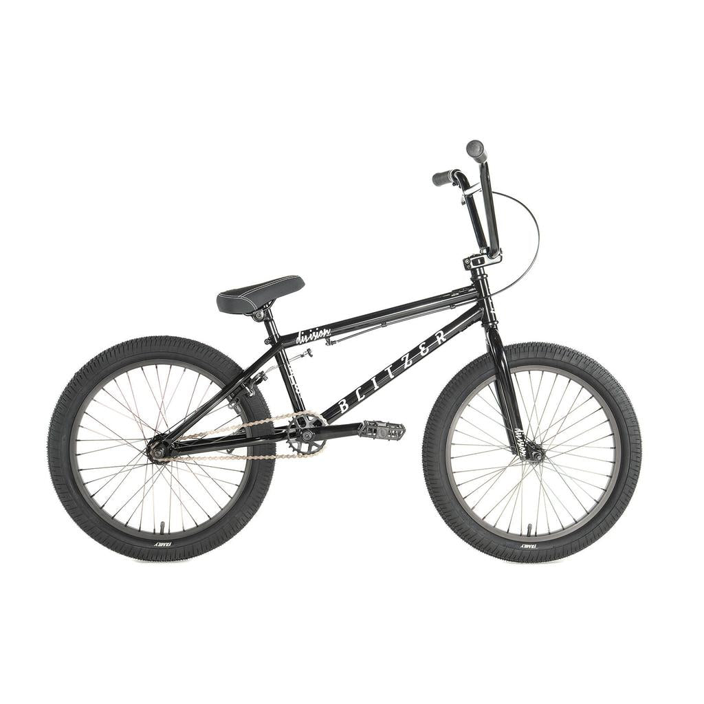 The Division Blitzer 20 Inch Bike is a black BMX with thick tires, upright handlebars, and a padded seat, displayed in profile view on a white background.
