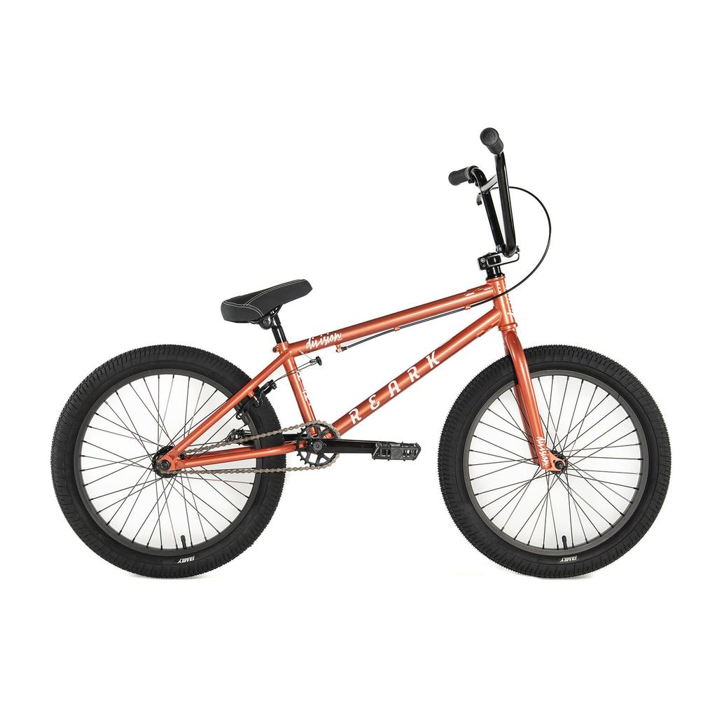 A side view of the Division Reark 20 Inch Bike in red, featuring black tires, black seat and handlebars, 3-piece cranks, and a lightweight Hi-Tensile steel frame, shown against a white background.