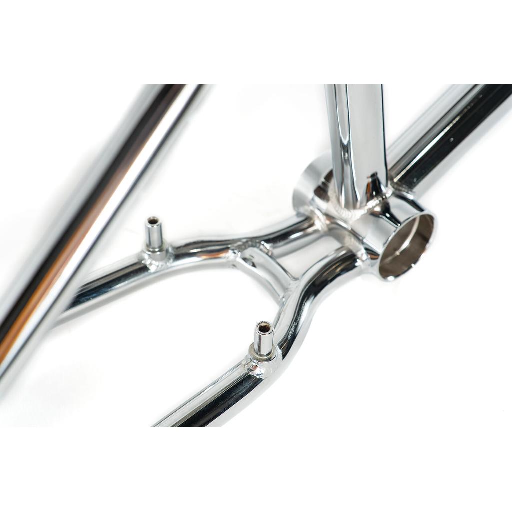 Close-up of the polished Colony Prody Frame's bottom bracket and dual brake mount posts—a sturdy, freestyle-ready BMX frame design.