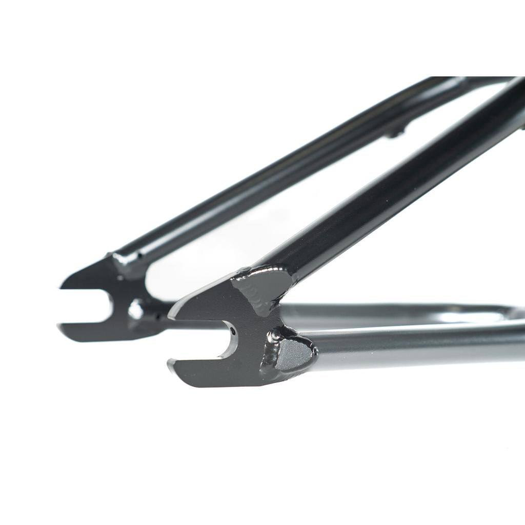 Close-up of the Colony Cadet 16 Inch Frame's rear dropout, showcasing smooth welds and a glossy CrMo finish.