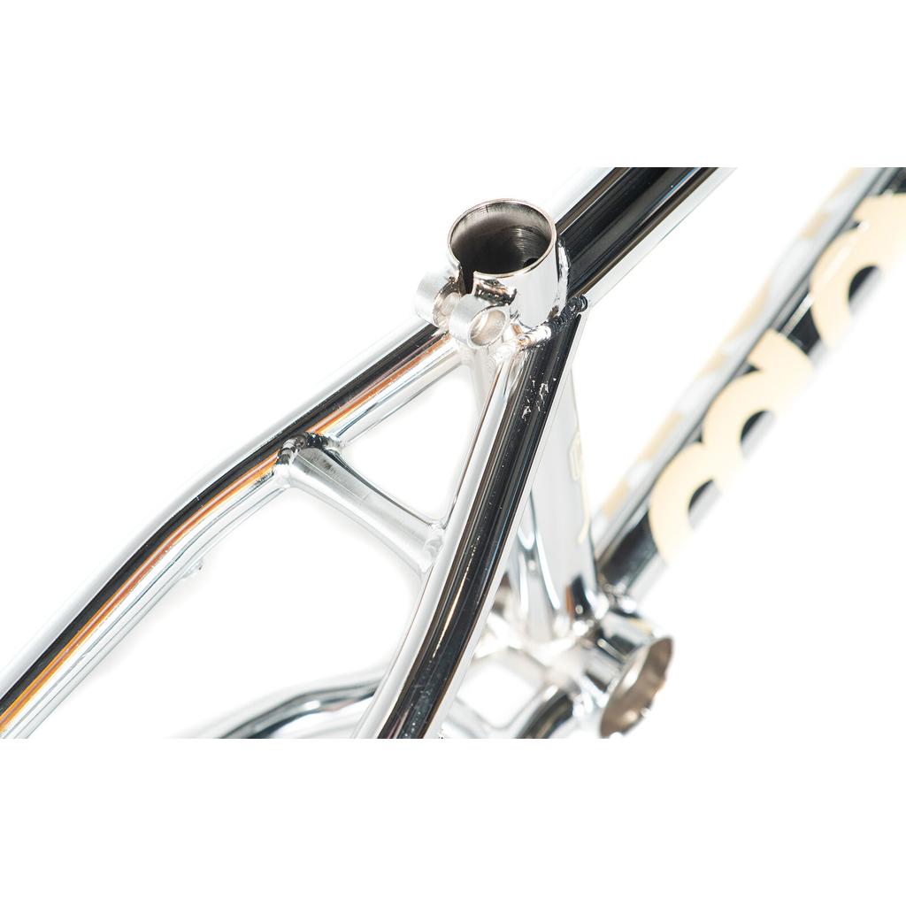 Close-up of the Colony Cadet 16 Inch Frame, focusing on the chrome rear triangle and seat tube junction, with part of the logo visible—showcasing its durable CrMo construction.