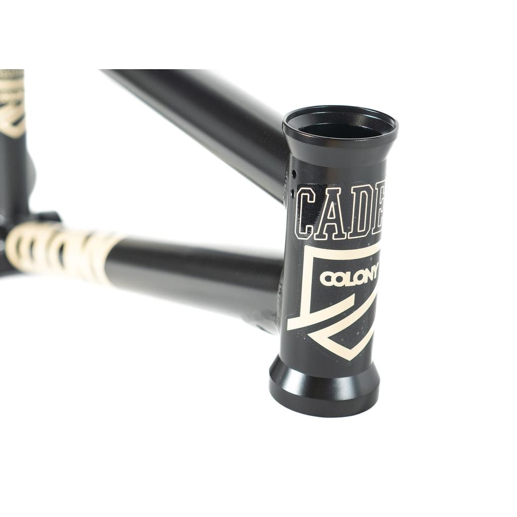 Close-up of the Colony Cadet 18 Inch Frame, a black chromoly BMX frame featuring "CADET" and "COLONY" in white lettering on the head tube.