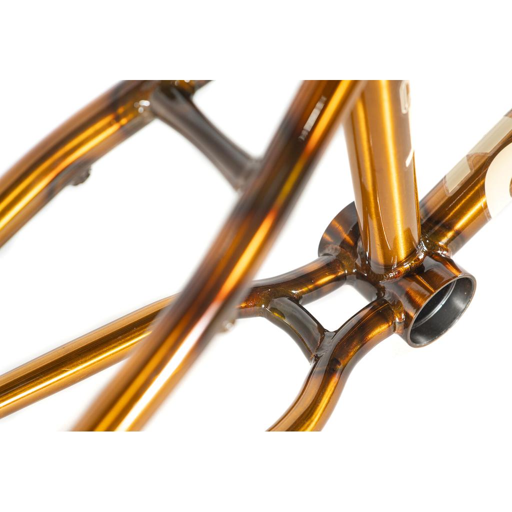 Close-up of a bronze-colored Colony Cadet 18 Inch Frame, showing the bottom bracket shell and chainstays.
