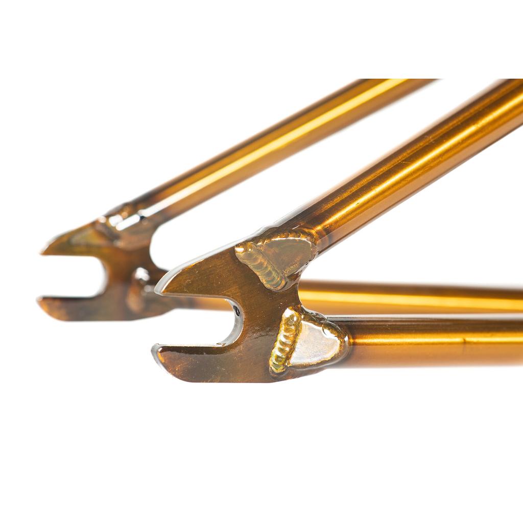 Close-up of golden brown Colony Cadet 18 Inch Frame dropouts with visible welded joints.