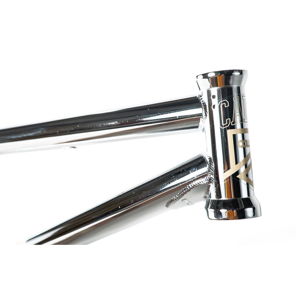 Close-up of the Colony Cadet 18 Inch Frame, highlighting its chrome chromoly head tube, metallic badge, and visible welds.