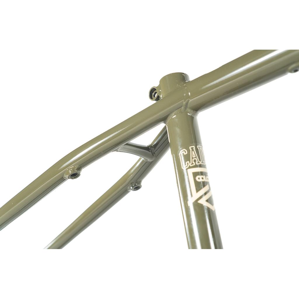Close-up of the Colony Cadet 20 inch Frame in olive green, highlighting the seat tube, seat stays, and partial branding. This durable chromoly BMX frame features park and street geometry against a clean white background.