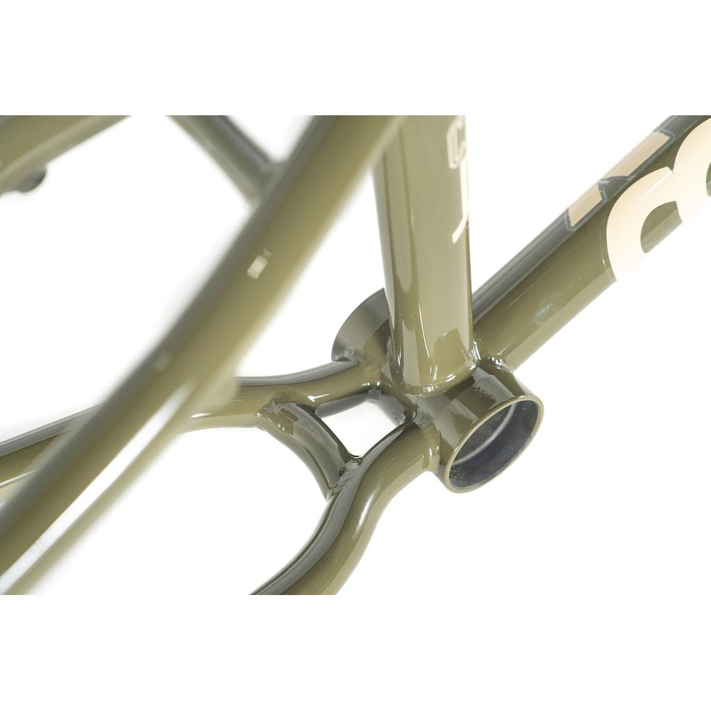 Close-up of the Colony Cadet 20 inch Frame in olive green chromoly, highlighting the bottom bracket shell and chainstay junction, built for park and street riding.