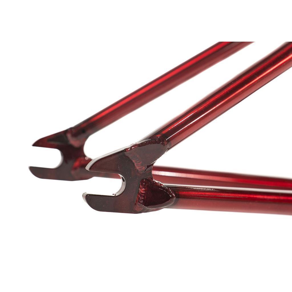Close-up of the dropouts and welded joints on the red Colony Injustice Frame (Tom Justice Signature), highlighting the rear triangle structure and metallic finish inspired by Tom Justice’s design.