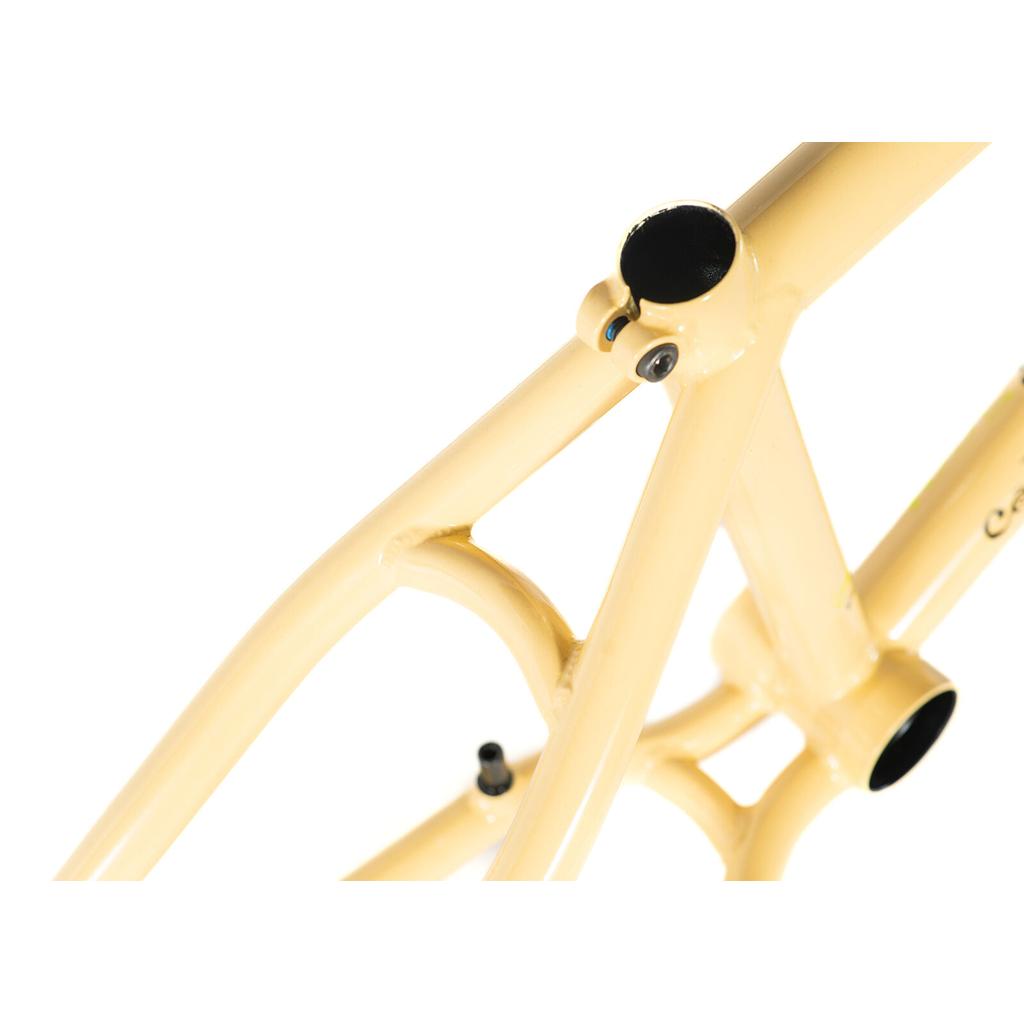 Close-up of a yellow Colony Sect Frame Kit showing the seat tube, top tube, and part of the rear triangle against a white background.