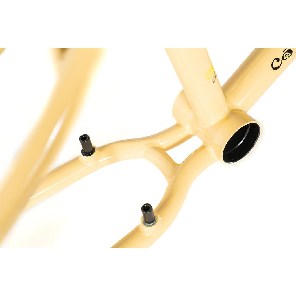 Close-up of the Colony Sect Frame Kit in beige, highlighting the bottom bracket shell and two chainstay mounting bosses—a perfect look at this limited edition BMX frame.