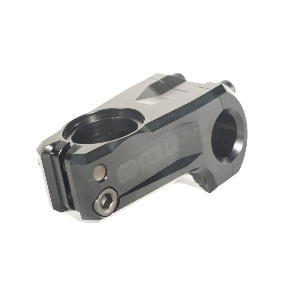 The Colony Official Front Load Stem is a black metal BMX stem with two circular openings and visible bolts, designed for connecting handlebars to the steering tube for a strong, secure fit.