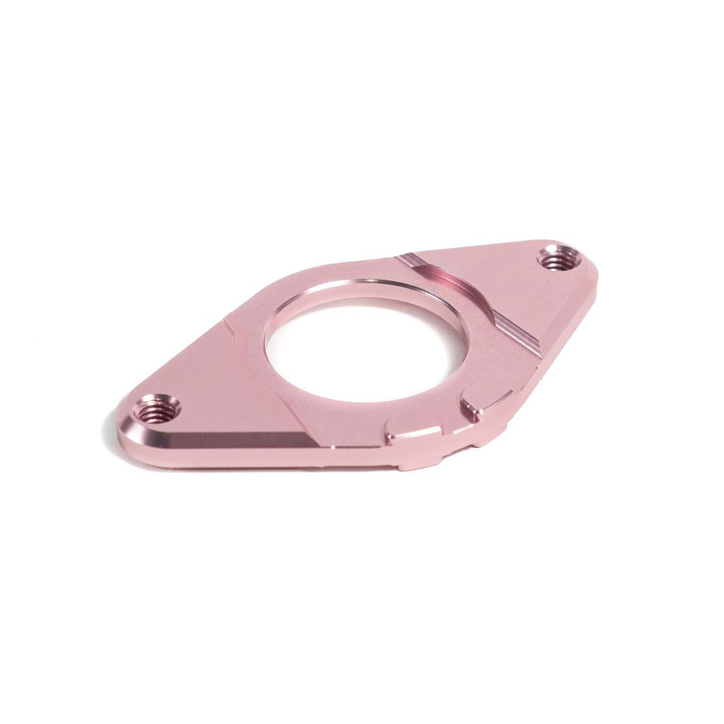 The Colony Gyro Plate is a pink anodized, CNC-machined 6061T6 alloy bracket with two screw holes and a central circular opening, shown on a white background.
