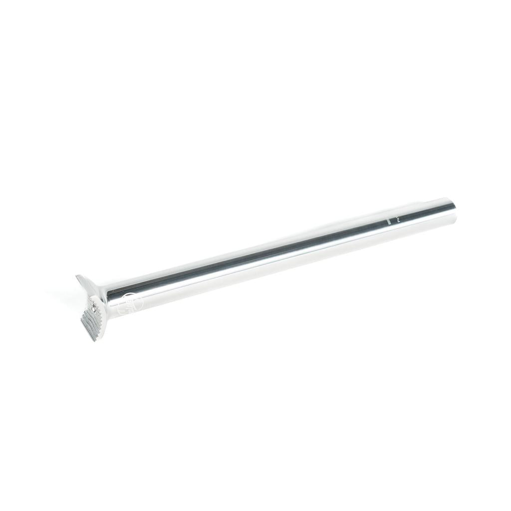 The Colony Pivotal Seat Post 330mm is a silver, cylindrical seatpost with an integrated saddle clamp—ideal for flatland bikes and shown on a white background.