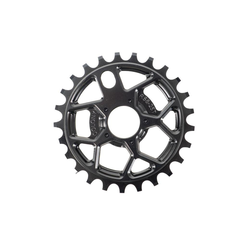 The Colony RS6 Sprocket is a black metal BMX sprocket with 25 teeth, showcasing cut-out geometric patterns and labeled with “RS25T” and “COLONY.” Crafted from robust 7075T6 Alloy for exceptional strength, this sprocket blends eye-catching design with high-performance materials, making it a top choice for upgrading your BMX setup.