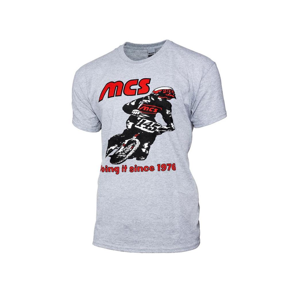 The MCS Retro 1976 (Greg Esser) T-Shirt is a gray tee with a motocross rider, bold red "MCS" at the top, and “Doing it since 1976” in red at the bottom, nodding to NBL National #1 PRO status.
