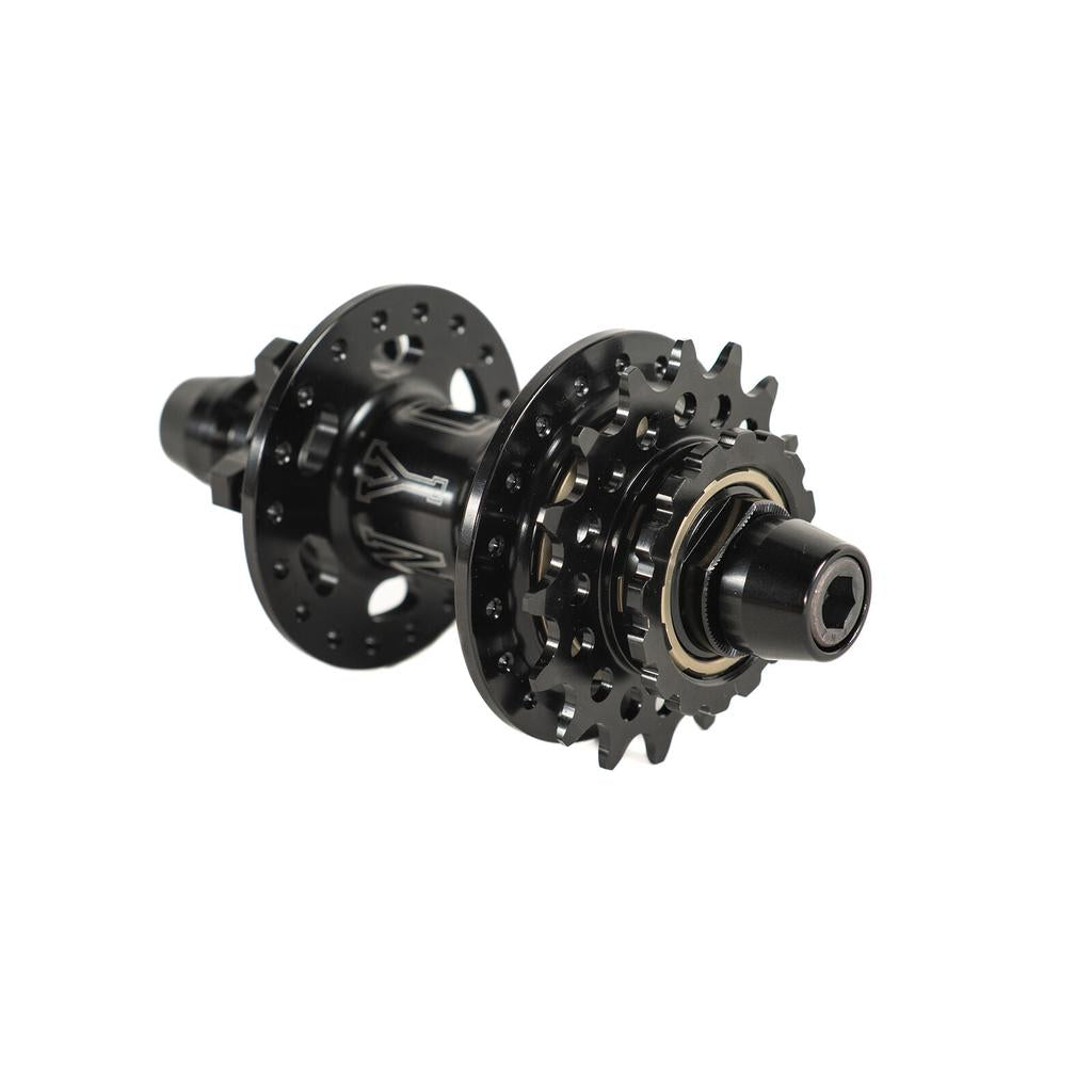 Black Colony Wasp Disc Race Front & Rear Cassette Hubset (36H) with a sprocket and spoke holes, isolated on a white background.
