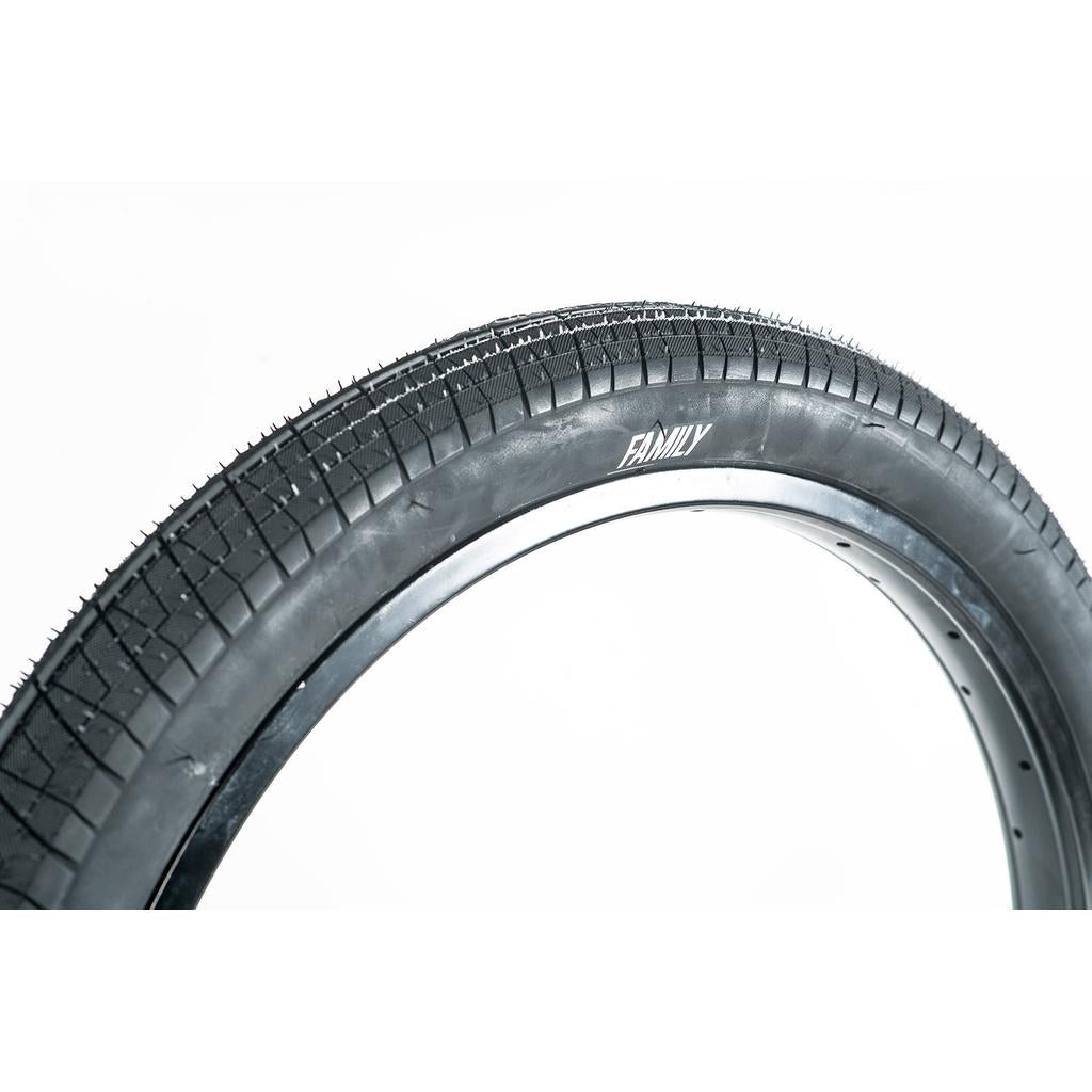 Close-up of the Family BMX F603 20 Inch Tyre in black, mounted on a rim with "FAMILY" branding on the sidewall. Perfect for BMX bikes and offers excellent value—shown against a white background.