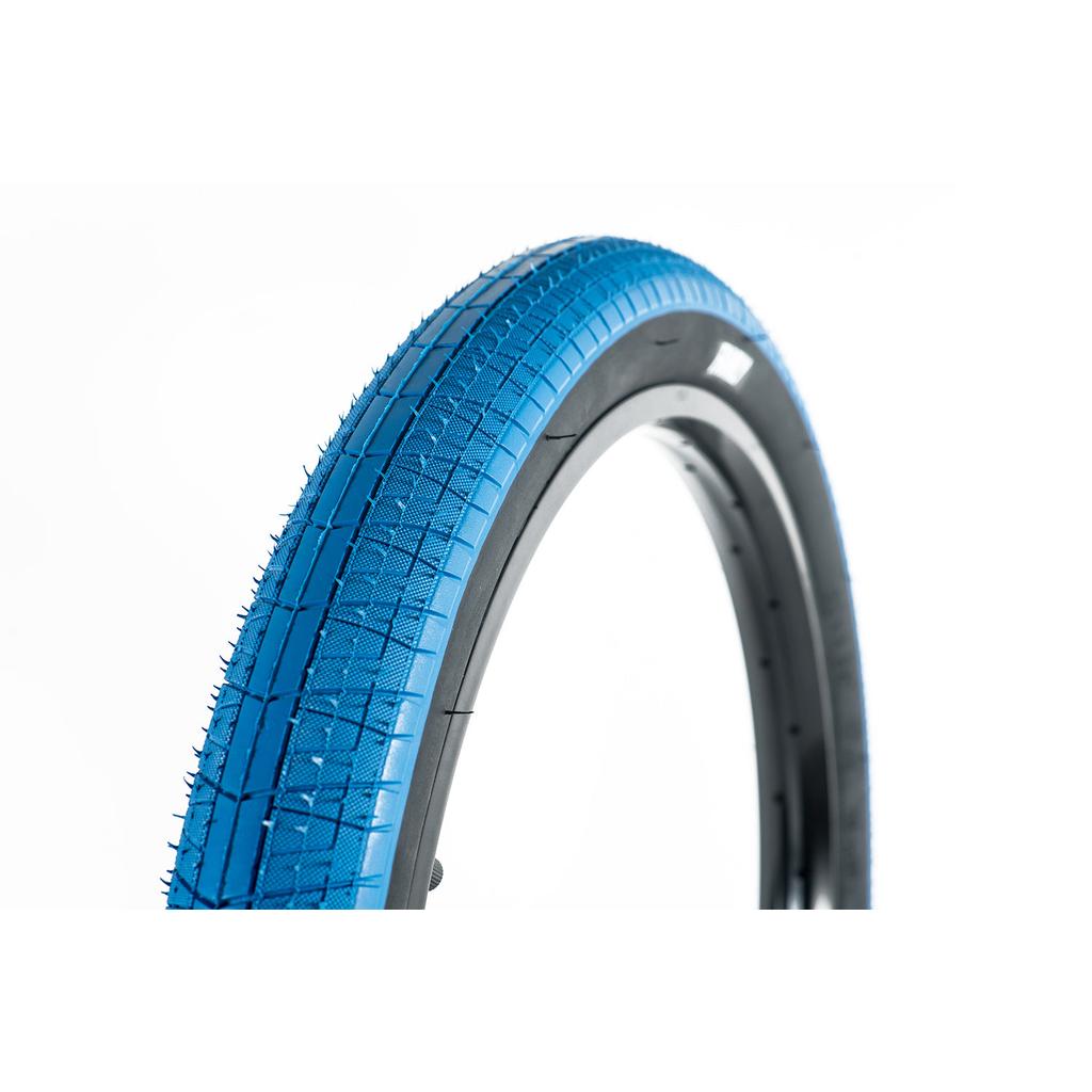 A close-up of the Family BMX F603 20 Inch Tyre in blue, mounted on a black rim, displayed against a plain white background.