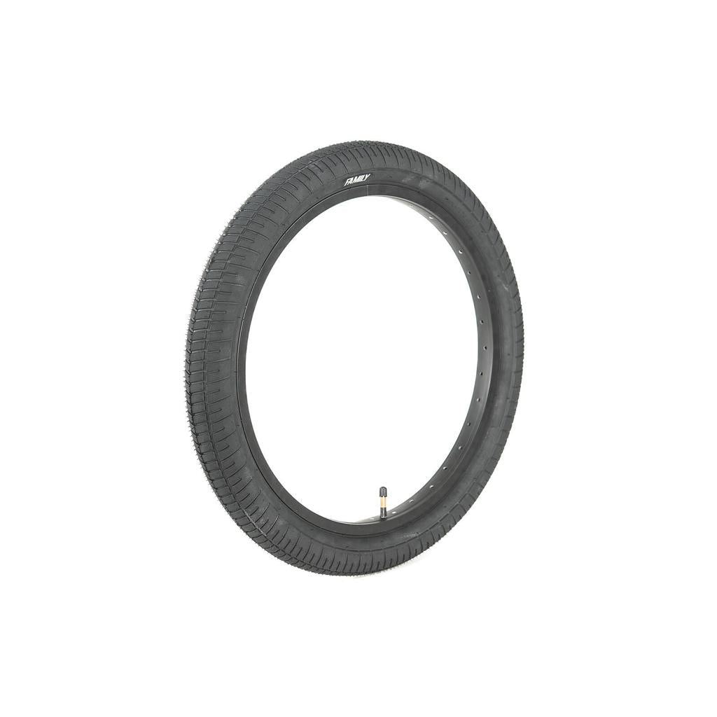 The Family F641 20 Inch Tyre is a black BMX tyre with a knurled tread, mounted on a metal rim with valve stem, offering excellent value and shown isolated on a white background.