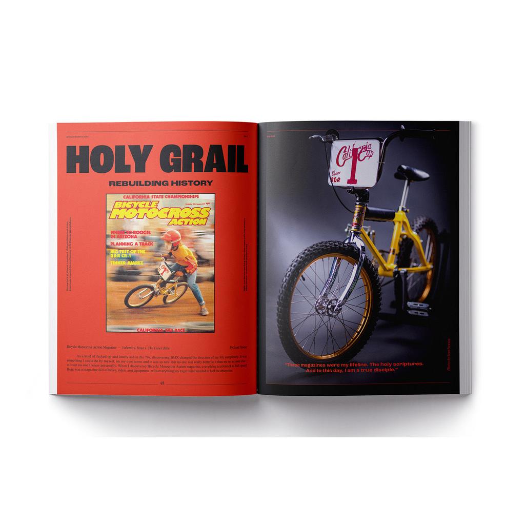 An open Greystoke Magazine V2 shows a vintage BMX bike on the right page and a bold "HOLY GRAIL" heading with the Greystoke cover and text on the left, capturing true BMX passion.