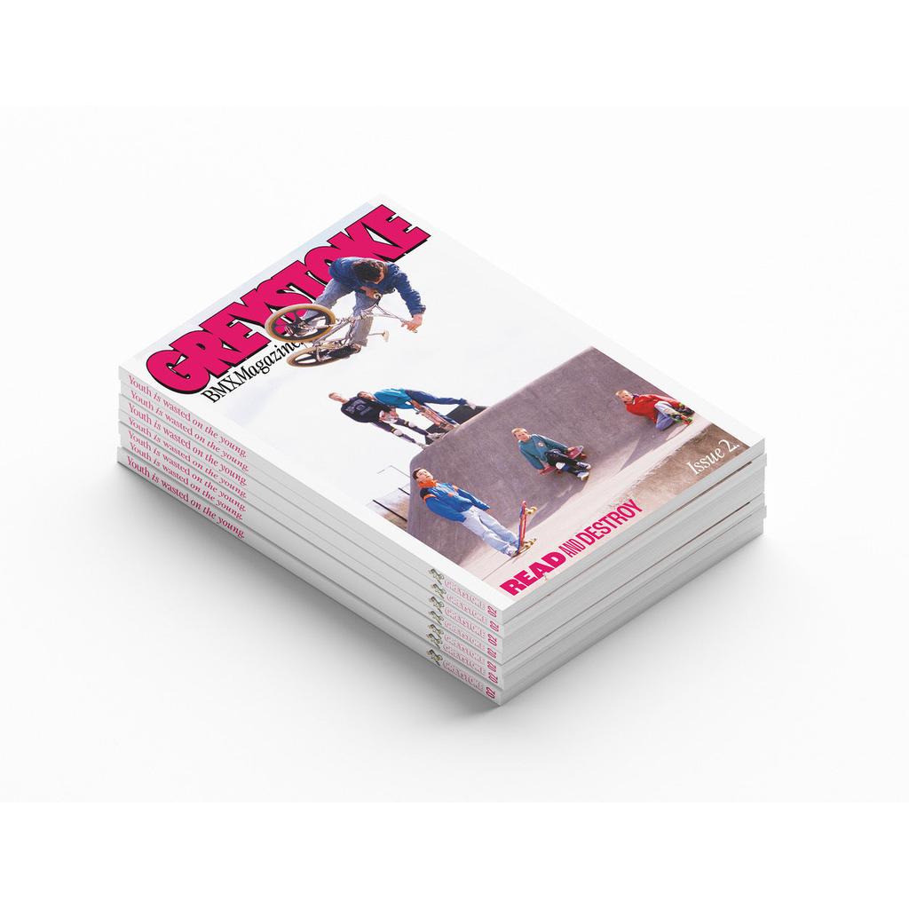 A stack of Greystoke Magazine V2, each featuring old-school BMX riders performing tricks on the cover.