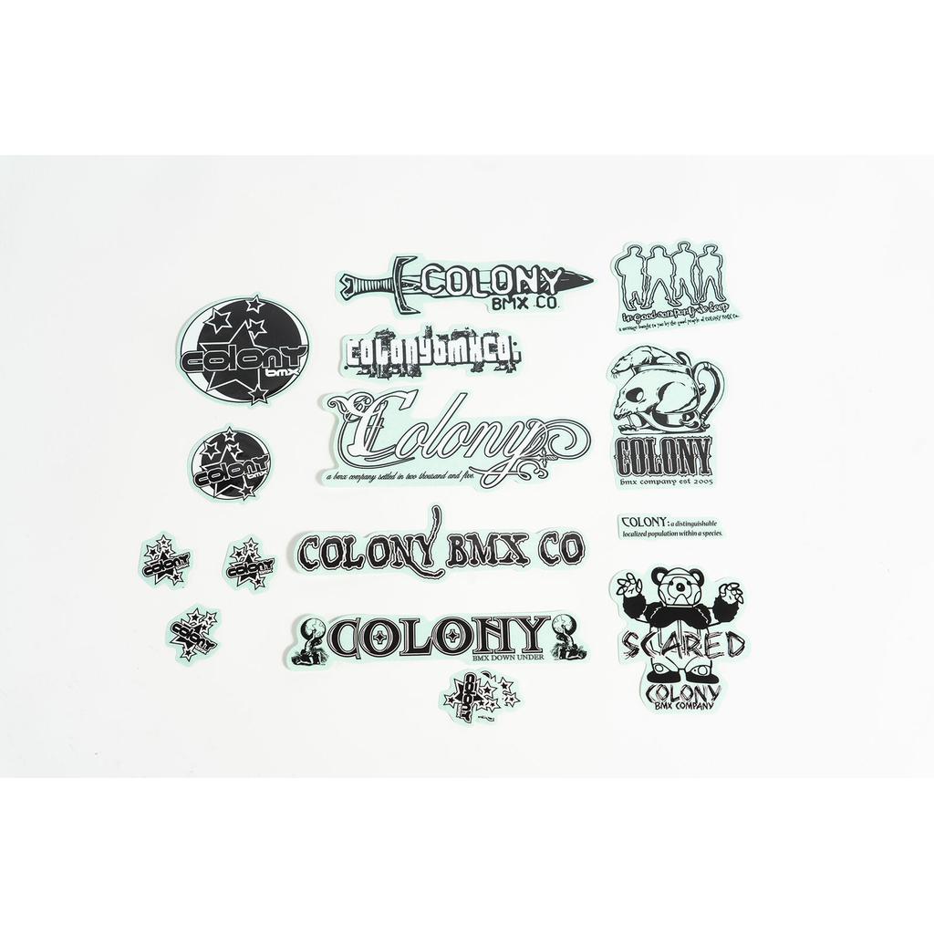 The Colony 2005 Sticker Pack features black and white BMX stickers with stars, unique fonts, and a cartoon bear design—ideal for customizing your bike or adding to any sticker collection.