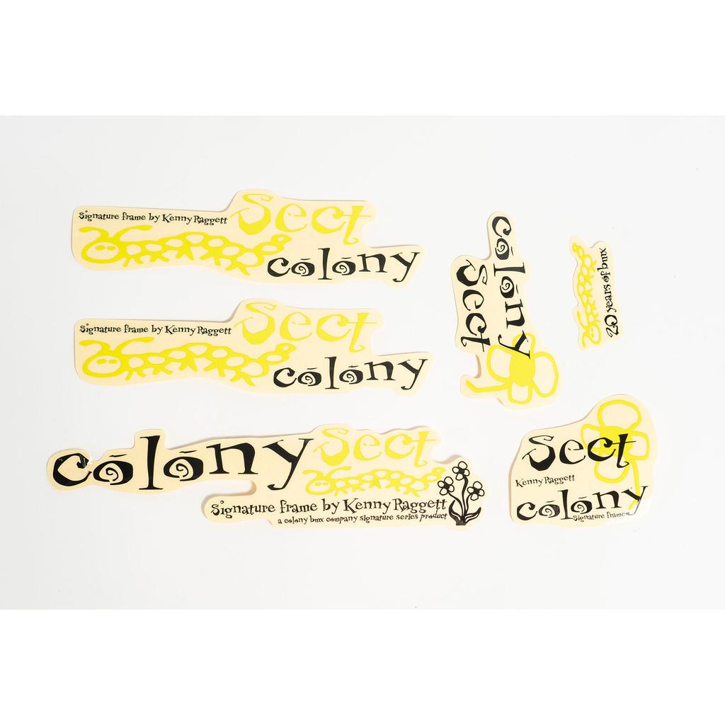 The Colony Sect 2005 Sticker Set includes yellow and black reissue stickers with "Sect Colony" and "Signature Frame by Kenny Peggott," ideal for customizing your Colony Sect Frame, all displayed on a white background.