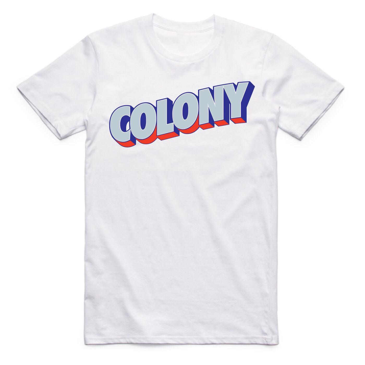 The Colony Postcard T-Shirt is a white AS Colour tee with "COLONY" in bold blue letters, white outlines, and a red shadow—ideal for BMX riders to rep their travel lifestyle.