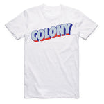The Colony Postcard T-Shirt is a white AS Colour tee with "COLONY" in bold blue letters, white outlines, and a red shadow—ideal for BMX riders to rep their travel lifestyle.