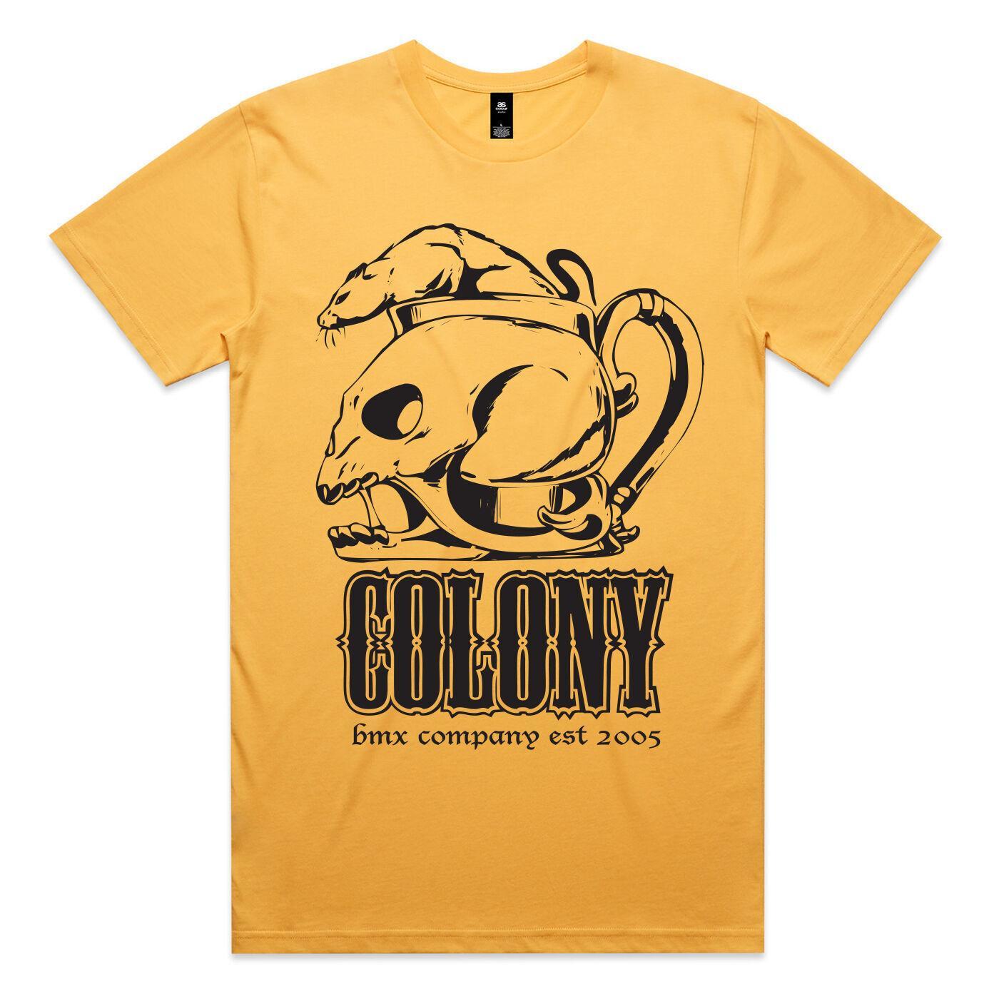 The Colony OG Rat T-Shirt is a yellow 100% cotton tee with rat-on-skull-in-teacup artwork and "COLONY" plus "bmx company est 2005" text, from the Colony BMX Sunset T-Shirt collection.