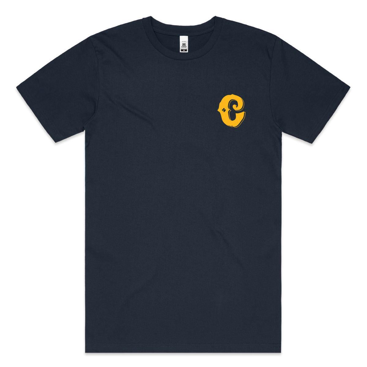 The Colony Have Fun T-Shirt is navy blue, made from 100% carded cotton, and features a small yellow and black stylized fish logo on the left chest.