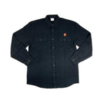 The S&M Shield Button Up Flannel Shirt is a heavyweight, long-sleeved black flannel made from 100% cotton. It features two chest pockets and a small red and yellow embroidered shield on the left pocket for style and durability.