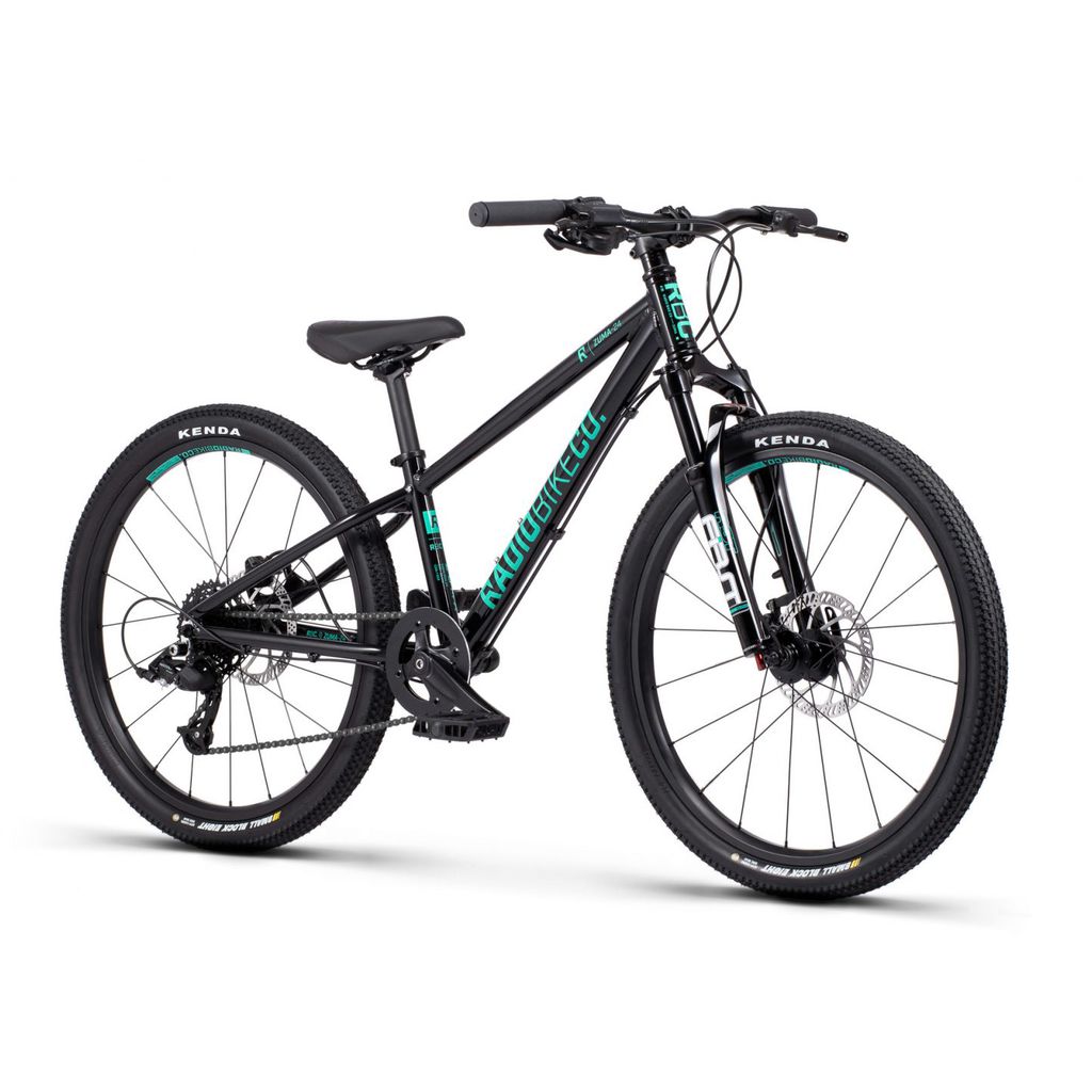 A Radio 24 Inch Zuma Sus Bike, featuring a lightweight alloy frame, comes in striking black and teal. It boasts large, thick tires, disc brakes, and a front suspension fork designed for off-road cycling.