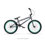 The Radio Saiko 20 Inch Bike, a black kids BMX with teal wheel rims, black pedals, Chromoly three-piece cranks, and a straight handlebar, is shown in profile against a white background.