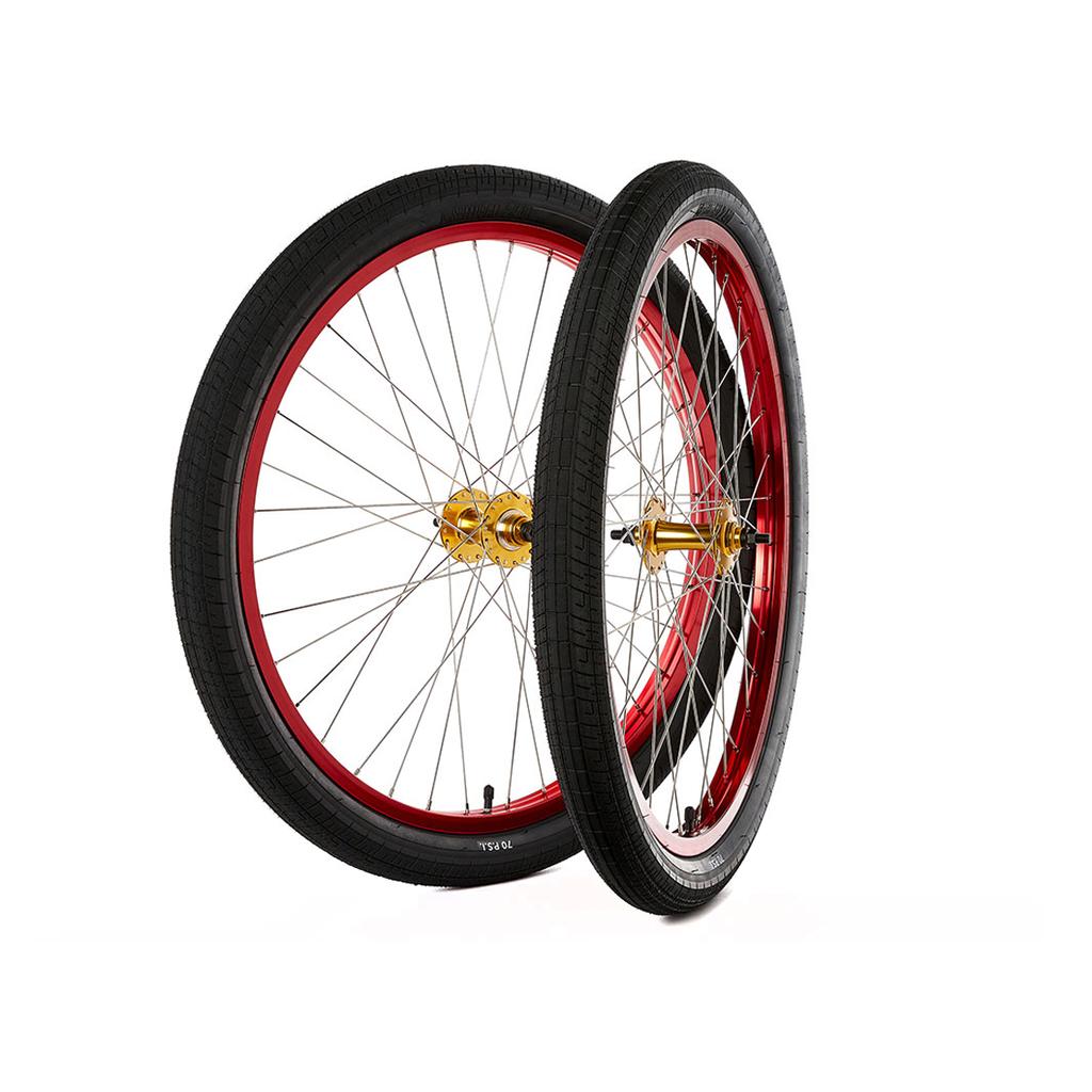 The S&M Covid 26 Inch Wheel Set, featuring two red wheels with double wall rims, Speedball tyres, and gold flip-flop hubs, is shown upright against a white background.