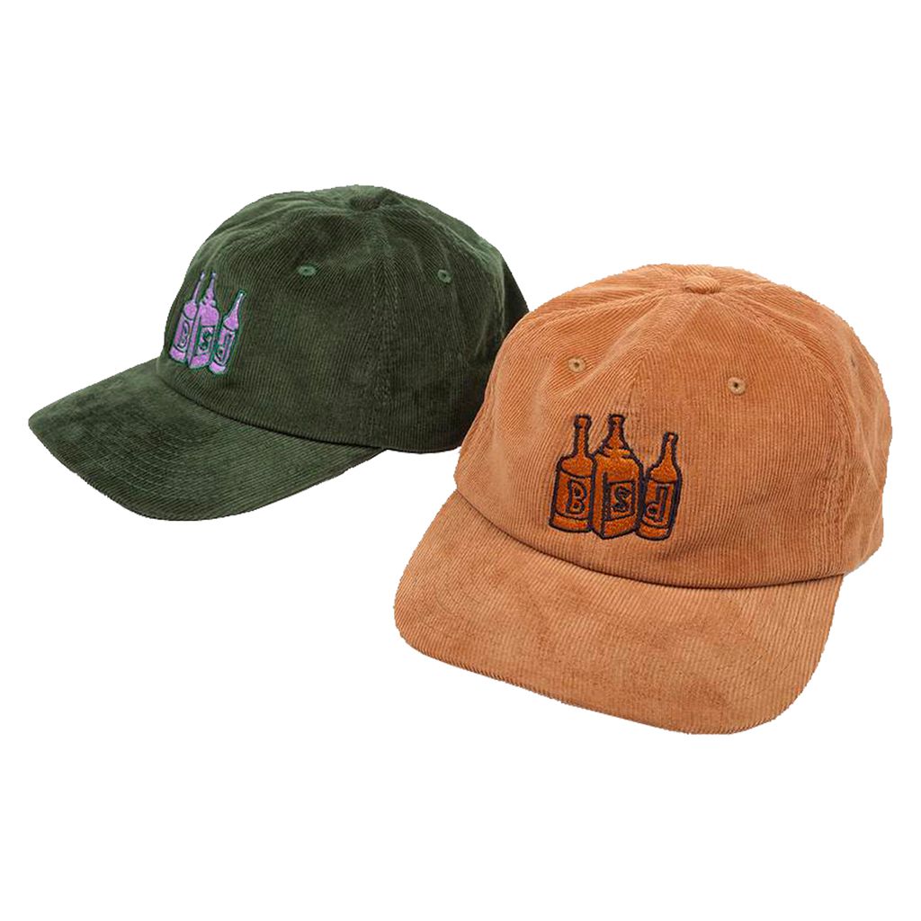 Two BSD Bottle Cap Unstructured corduroy baseball caps: one green with purple bottle embroidery and one brown with orange bottle cap embroidery.