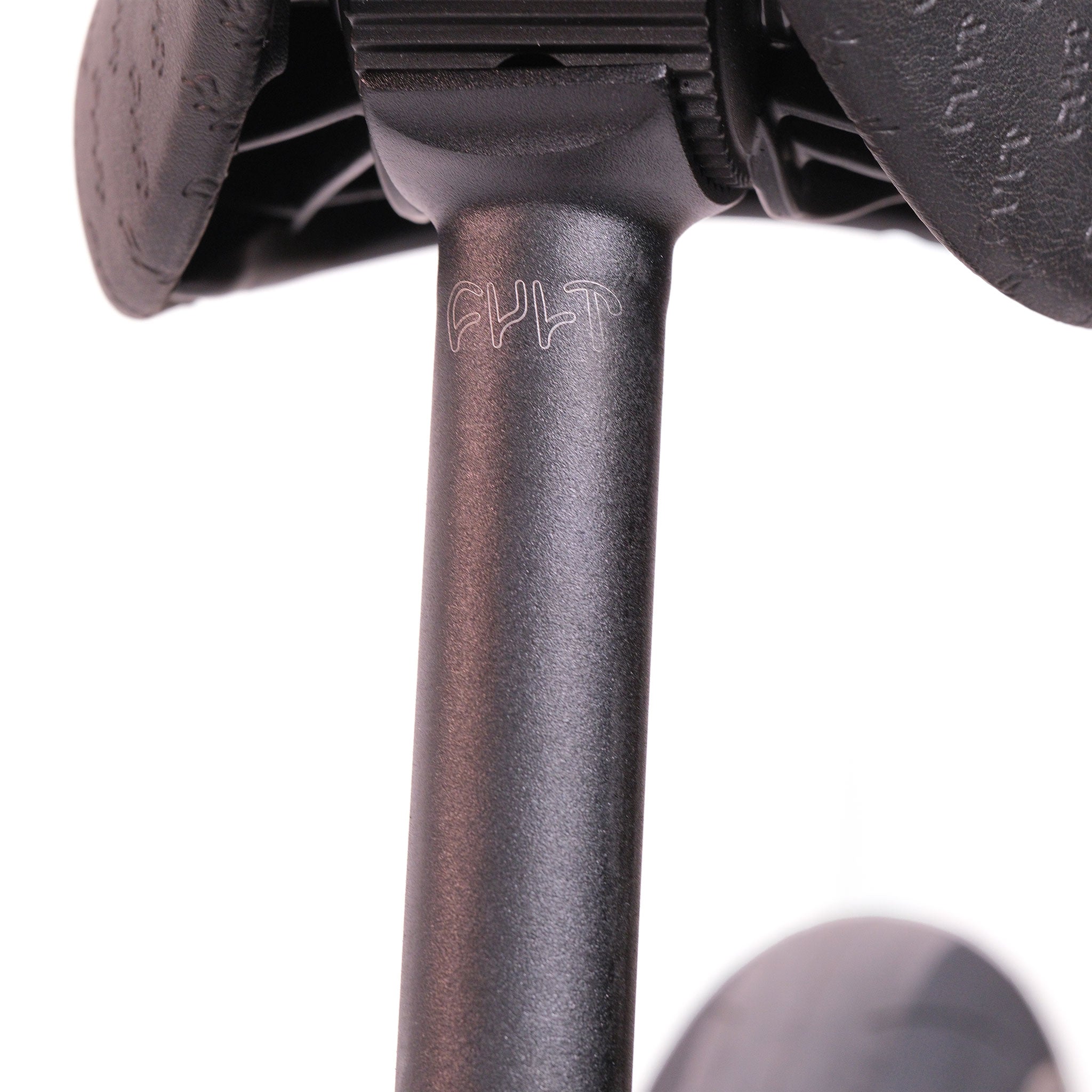 Close-up of a black BMX seat post with "CULT" engraved, fitted to a padded saddle—perfectly complementing the Cult Dak X Eclat Custom 'Pat Freyne Signature' bike.