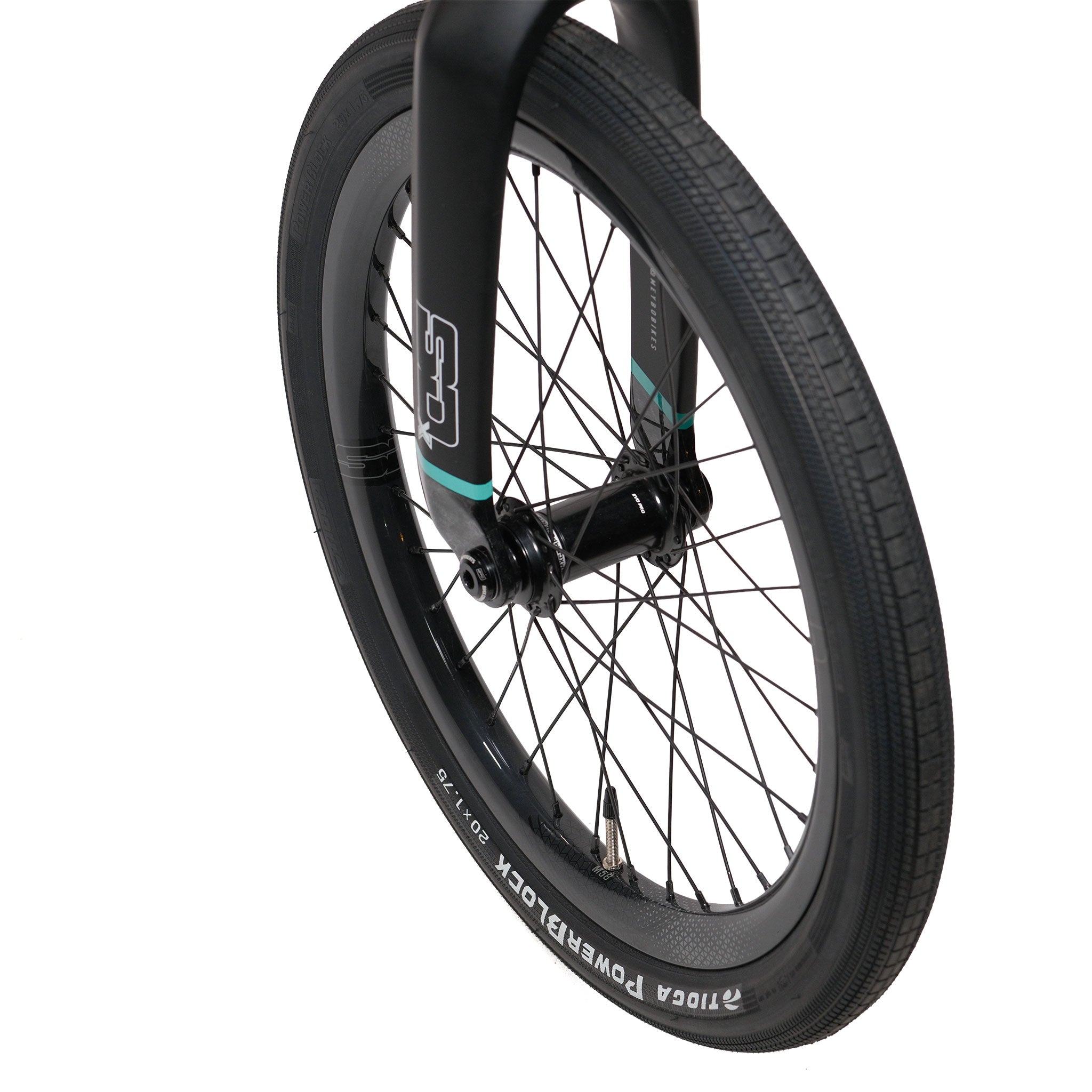 Close-up of a black bicycle front wheel with black spokes, a tire labeled "TIOGA POWERBLOCK," and part of the black front fork visible against a white background, showcasing premium BMX components typically featured on high-performance models such as the Meybo HSX Carbon Pro XXL Race Bike.
