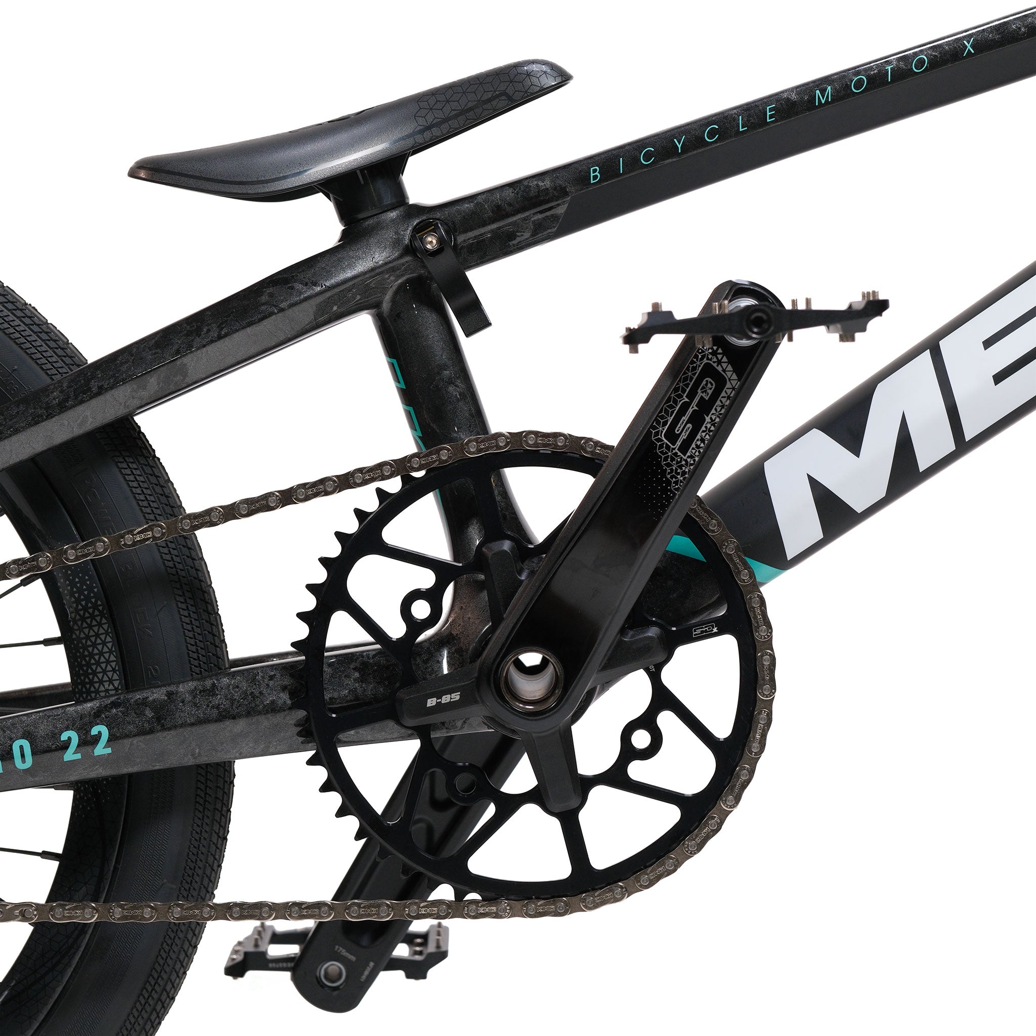 Close-up of a black BMX bike's drivetrain, featuring the chain, pedals, crank, chainring, and part of the seat and frame—showcasing BMX parts on a Meybo HSX Carbon Pro XXL Race Bike.